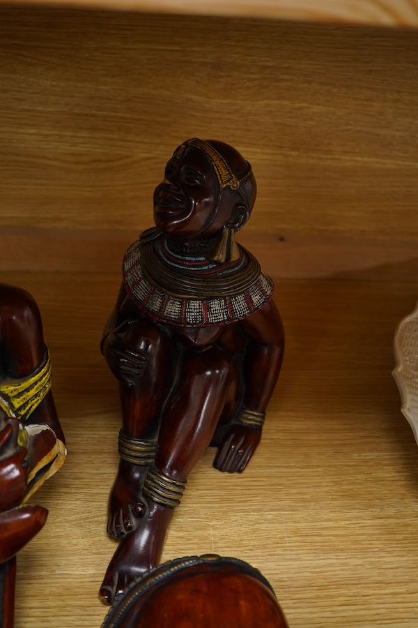 Four Kenyan faux wood figures/busts, signed Masai